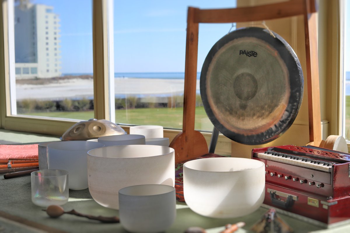 Singing bowls and gong with ocean view